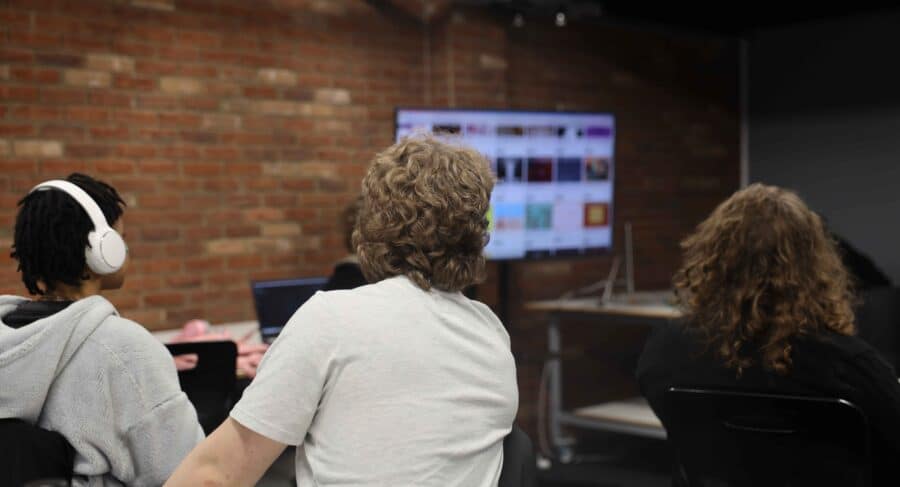 MetStudios students watch monitor in class