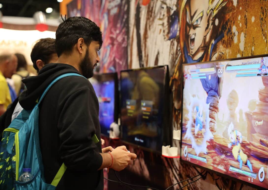 ComicCon gamer using console