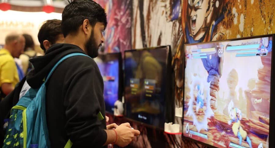ComicCon gamer using console