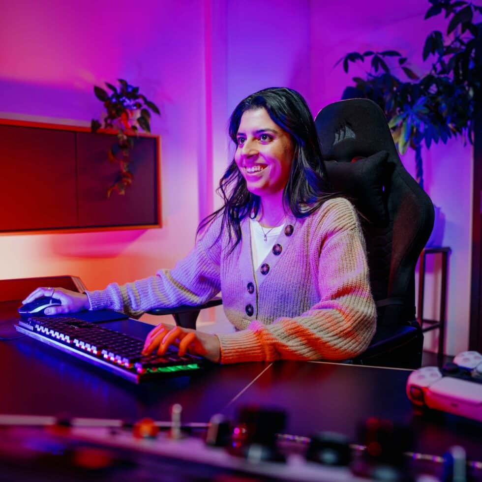 MetStudios smiling game design student using computer
