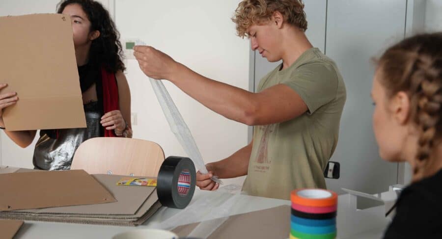 MetStudios students working at a workshop together with materials